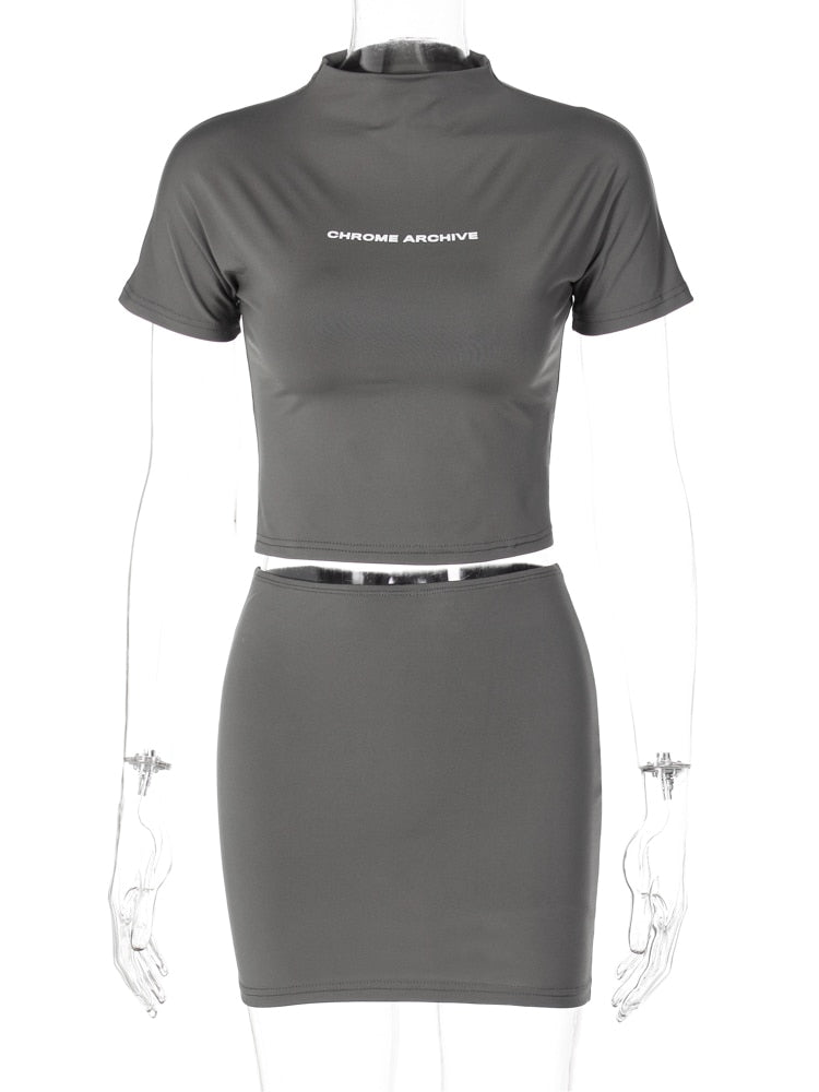 Hugcitar Letter Print Solid Turtleneck Short Sleeves Crop Top Skirts 2 Pcs Set Sexy Slim Summer Fashion Outfit Streetwear Sports