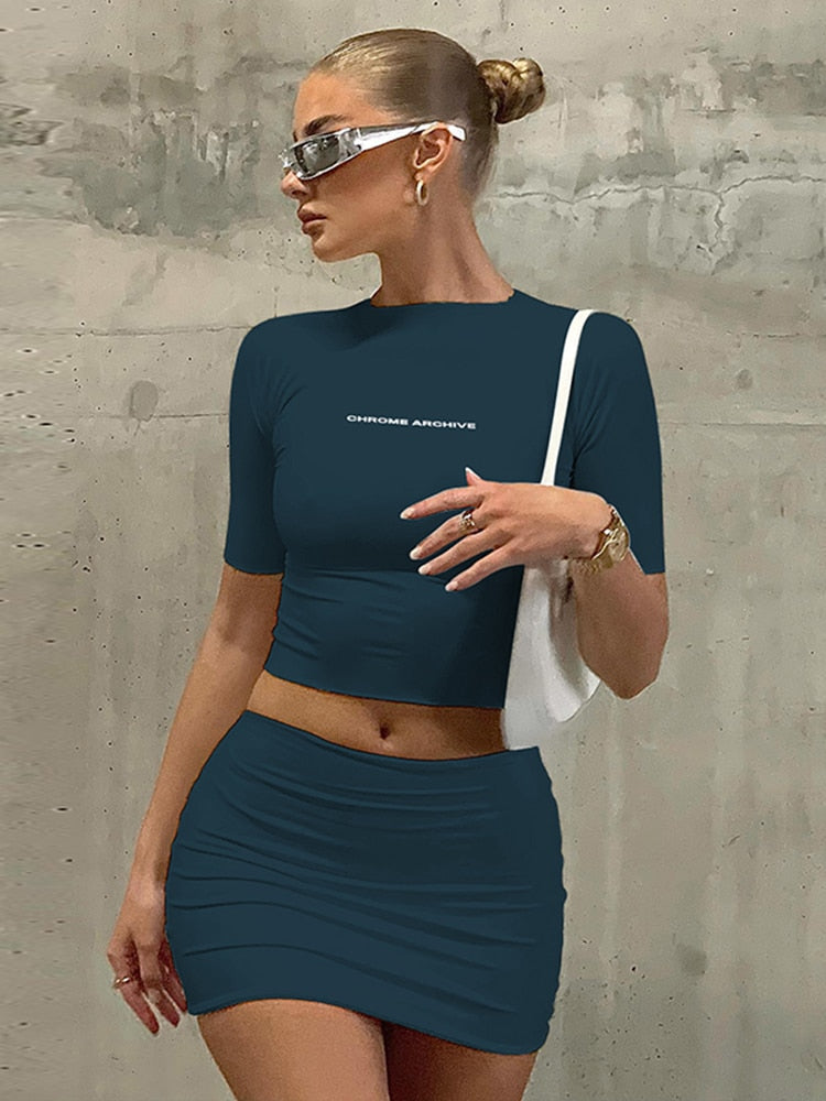 Hugcitar Letter Print Solid Turtleneck Short Sleeves Crop Top Skirts 2 Pcs Set Sexy Slim Summer Fashion Outfit Streetwear Sports