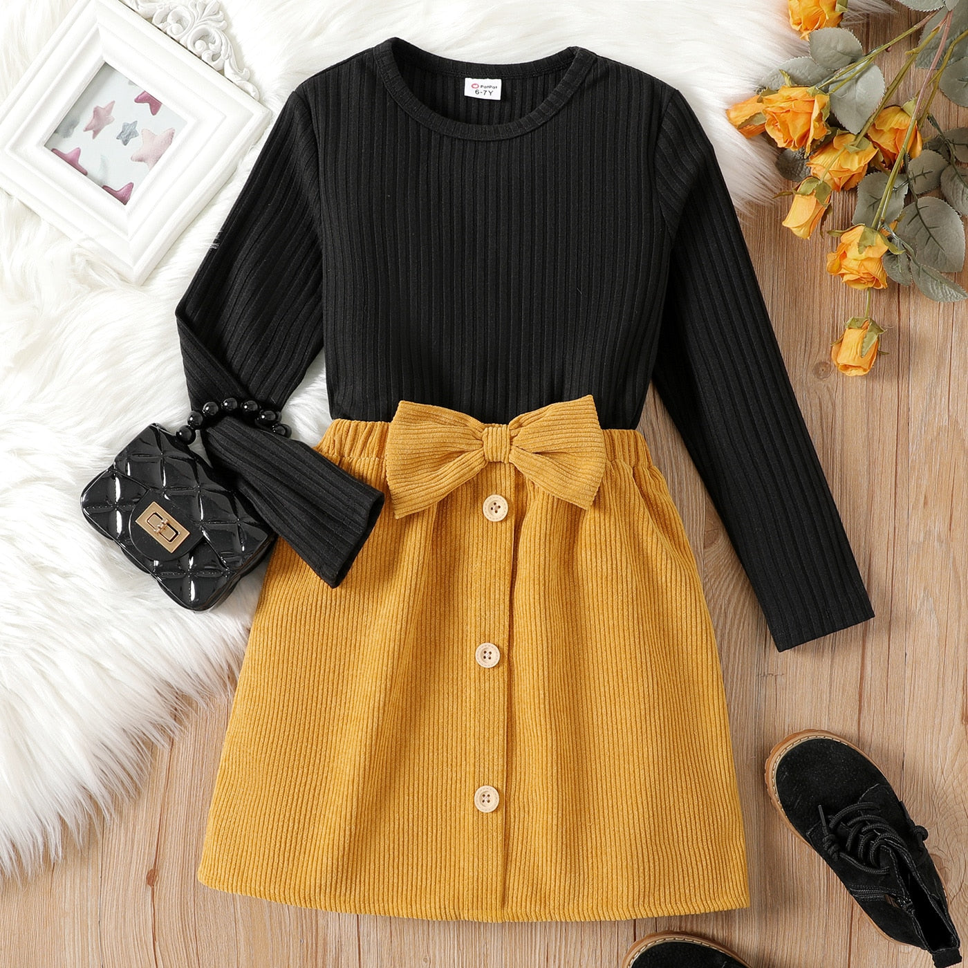PatPat 2pcs Kid Girl Ribbed Long-sleeve Black Tee and Bowknot Button Design Skirt Set